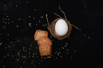 Egg and Bread Feast: A harmonious composition featuring a pristine egg nestled in a handcrafted...