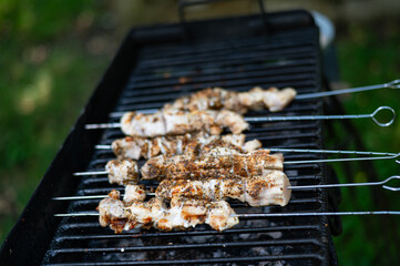Traditional shashlik cooking on a grill