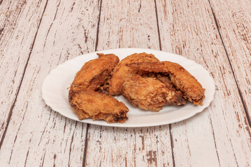 Traditional-style fried chicken wings with a balanced seasoning that highlights the natural flavor of the chicken