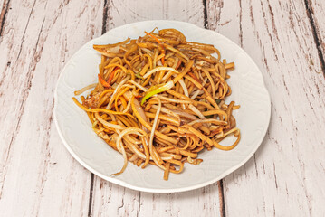 Luxury noodles with lobster: shredded whole seafood, accompanied by al dente vegetables and brown rice noodles