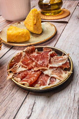 amón, both Serrano and Iberian, is a symbol of national pride. It is prominently displayed in bars and shops, a testament to the country's gastronomic richness