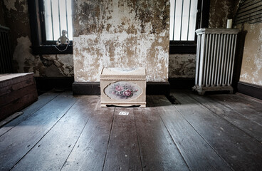 Toy box in a empty attic inside a revolutionary war abandoned home