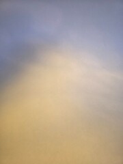 yellow toned to slate gray textured variegated gradient background 