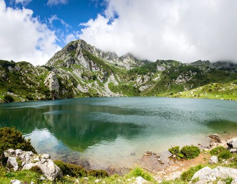 Mountain lake scene under a partly cloudy sky - Powered by Adobe