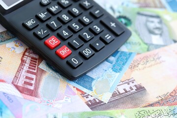 Bahraini dinar currency money bills and calculator. The concept of taxation and money count
