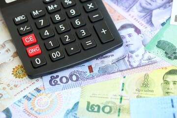 Thai baht currency money bills and calculator. The concept of taxation and money count