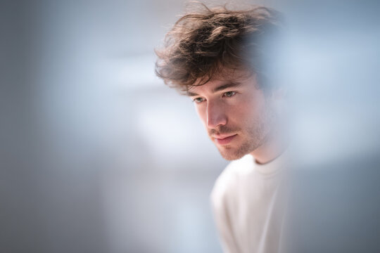 minimalist portrait of ux designer surrounded by blurred white text bars representing ar annotations