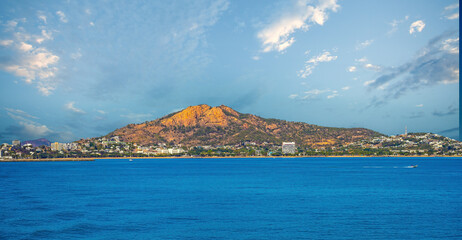 Panoramic view of the city of Townsville, Queensland, Australia, withg its iconic Castle Hill, a prominent granite monolith,in the background