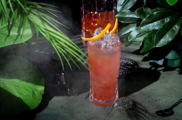 Rose lady, low alcoholic cocktail drink with cider, cranberry and orange juice. Deep green...