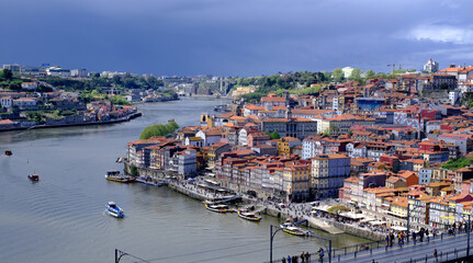 A stunning panoramic view of the colorful city of Porto, Portugal, as seen from across the Douro...