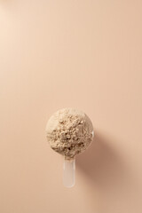 Protein powder. Chocolate flavoured protein powder in scoops, top view