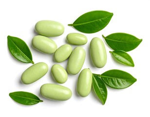 Light green pills and fresh green leaves
