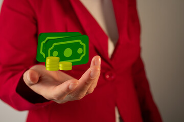 Businesswoman holding a 3D icon of banknotes with golden coins