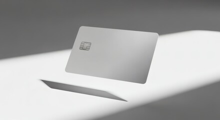A photorealistic image of a credit card mockup with a blank design, floating above a clean white background, with dramatic shadows, creating a premium style.