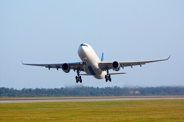 Large passenger aircraft taking off and landing
