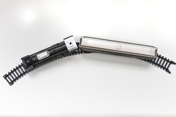 Top View of Toy Train Locomotive and Car on Tracks