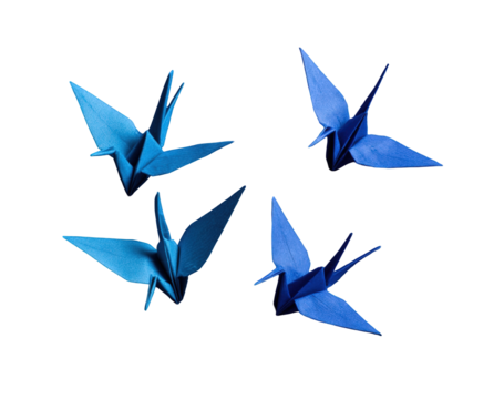 Four blue origami cranes arranged in a symmetrical pattern against a black background