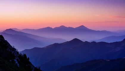 Fototapeta premium layered mountain ranges stretch into the distance during a hazy purple sunset creating a serene and picturesque landscape with soft light