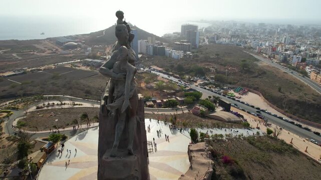 SENEGAL - 7.14.2025 - Wonderful aerial footage circling clockwise around the African Renaissance Monument in Senegal. - Powered by Adobe