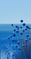Blue flowers by a tranquil sea