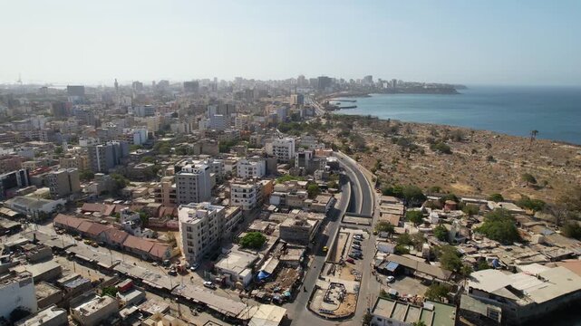 SENEGAL - 7.14.2025 - Excellent aerial footage following a coastal highway in Dakar, Senegal.