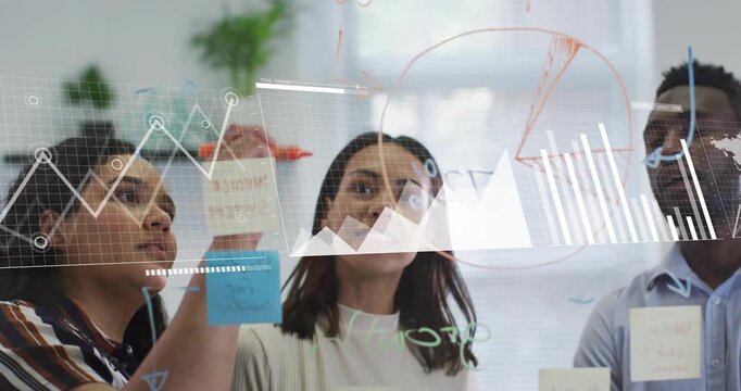 Woman adjusting blue note and handing marker to team, sketching business charts on glass partition