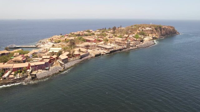 SENEGAL - 7.14.2025 - Great aerial footage approaching the piers of Senegal's Goree Island, a former hub of the slave trade.