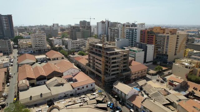 SENEGAL - 7.14.2025 - Very good aerial view circling a building under construction in Dakar, Senegal.