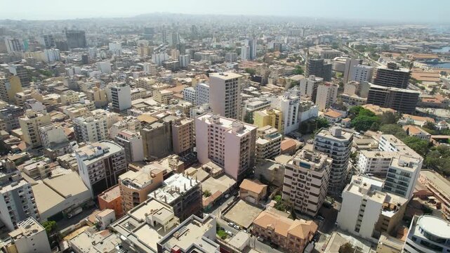 SENEGAL - 7.14.2025 - Stunning aerial footage pulling back from buildings of Dakar, Senegal.