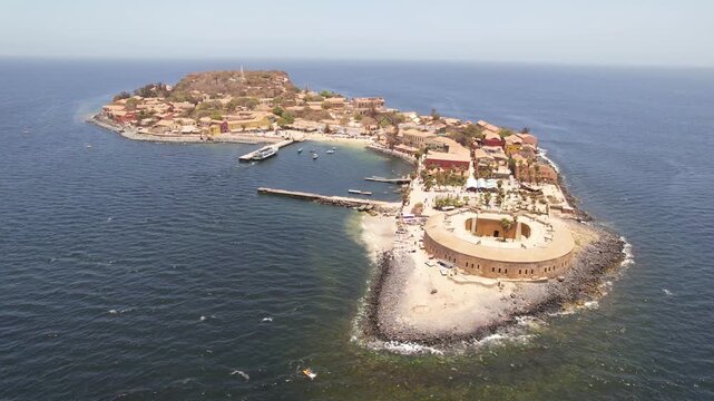 SENEGAL - 7.14.2025 - Strong aerial footage circling counterclockwise around Senegal's Goree Island, a former hub of the slave trade.