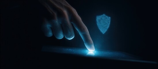 Hand touching a glowing tablet screen with a holographic shield graphic