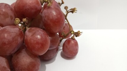 red grapes on a white background
