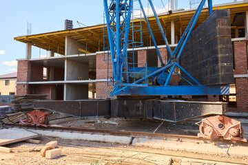 Construction Site Showcasing a Large Crane and Building Framework Actively Under Progress
