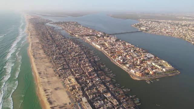 SENEGAL - 7.16.2025 - Wonderful aerial footage starting to circle clockwise around Senegal's Island of Saint-Louis.