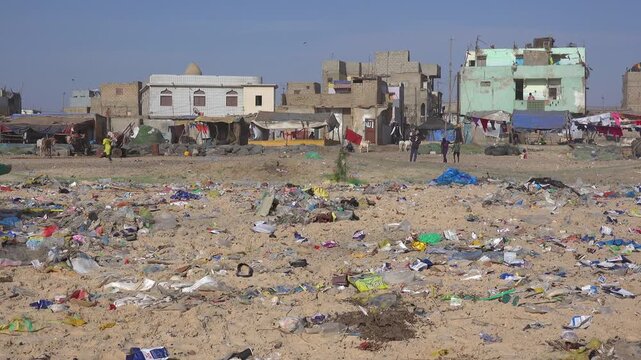 SENEGAL - 7.16.2025 - A beach on Senegal's Island of Saint-Louis is strewn with garbage.