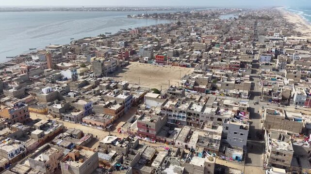 SENEGAL - 7.16.2025 - Very good aerial footage circling clockwise away from the beach on Senegal's Island of Saint-Louis.
