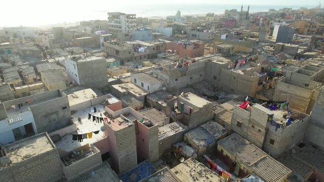 SENEGAL - 7.16.2025 - Good aerial footage panning neighborhood rooftops on Senegal's Island of Saint-Louis.