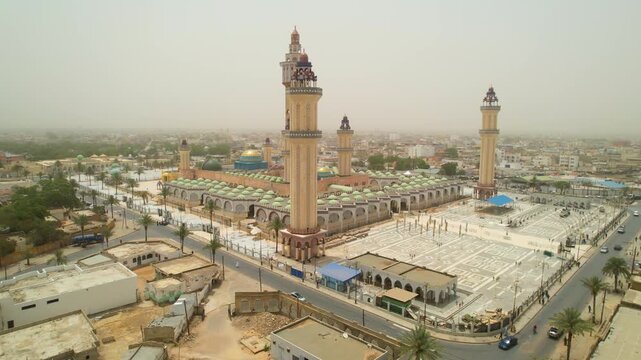 SENEGAL - 7.21.2025 - Fantastic aerial footage starting to circle counterclockwise around Senegal's Great Mosque Of Touba.