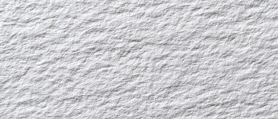 Close-up of a textured, light gray surface with a slightly rough, uneven pattern