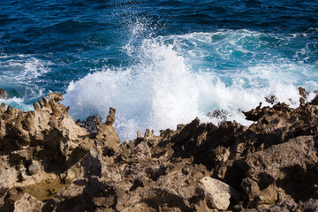 Ocean waves crashing on rocky coast