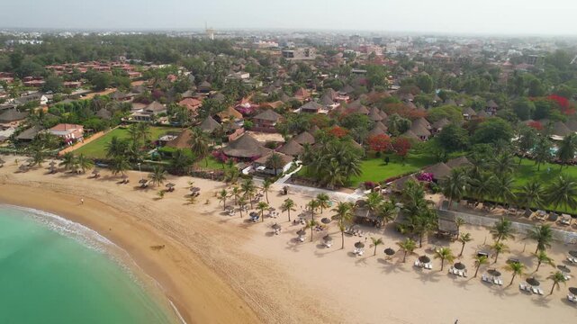 SENEGAL - 7.21.2025 - Fantastic aerial footage moving across a seaside resort in Saly, Senegal.