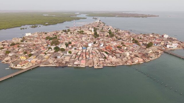 SENEGAL - 7.31.2025 - Great aerial footage circling counterclockwise around the island of Joal-Fadiouth, Senegal.