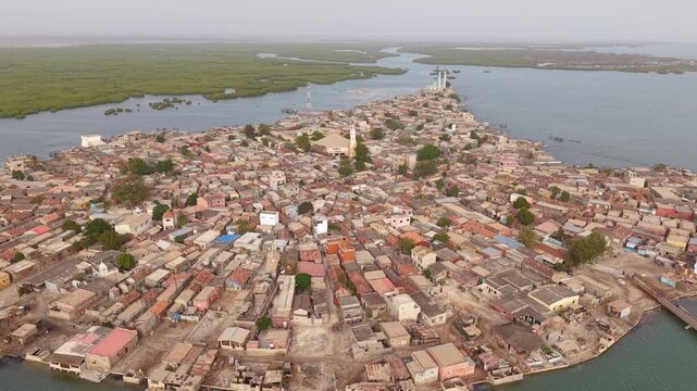 SENEGAL - 7.31.2025 - Wonderful aerial footage moving over the island of Joal-Fadiouth, Senegal.