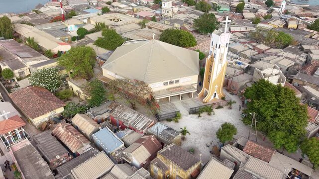 SENEGAL - 7.31.2025 - Very good aerial footage zooming out from a mosque on the island of Joal-Fadiouth, Senegal.