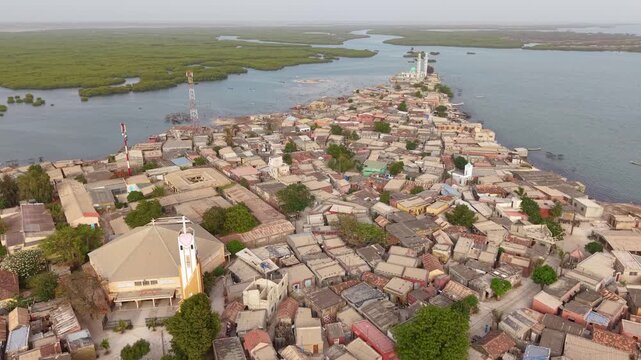 SENEGAL - 7.31.2025 - Great aerial footage moving from one mosque to another on the edge of the island of Joal-Fadiouth, Senegal.