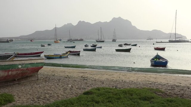 CAPE VERDE - 8.20.2025 - Small boats are docked off the coast of Mindelo on Sao Vicente, Cape Verde.