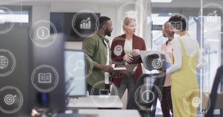 Team opening laptop and swiping tablet while showing animated data icons reviewing business metrics - Powered by Adobe