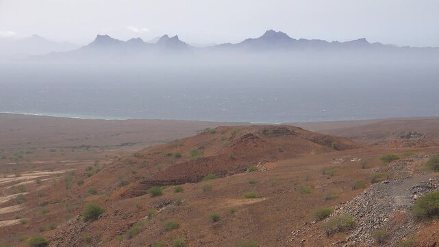 CAPE VERDE - 8.20.2025 - Gorgeous view of misty Sao Vicente across the water from Santo Antao, Cape Verde.