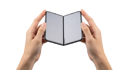 Hands holding a folded smartphone with blank screens against a black background