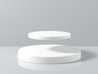 Two minimalist white circular podiums on a grey background with soft shadows